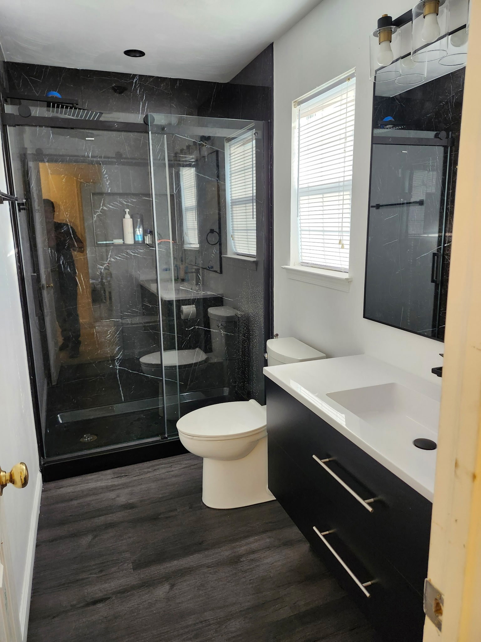Black custom vanity and finished bathroom interior
