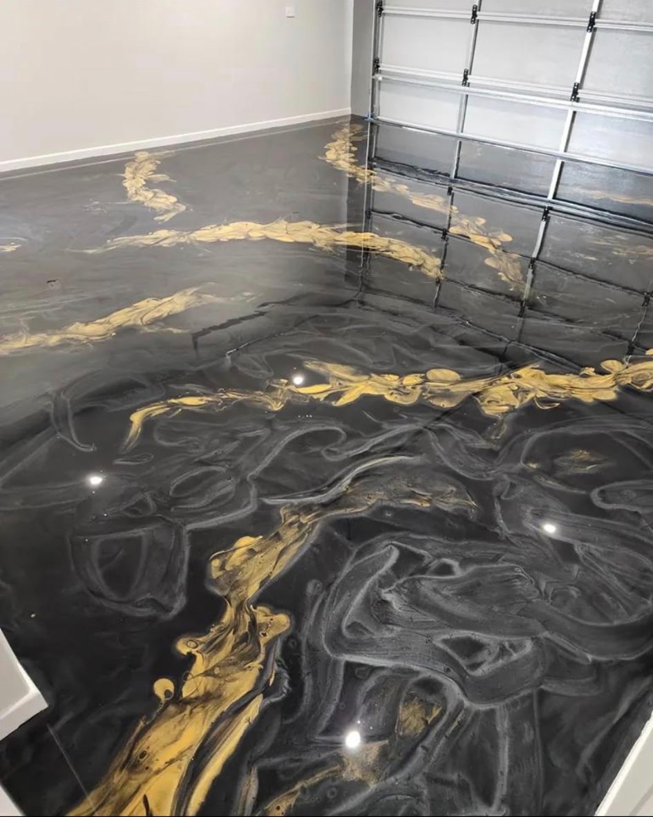 Finished black and gold metallic resin garage floor
